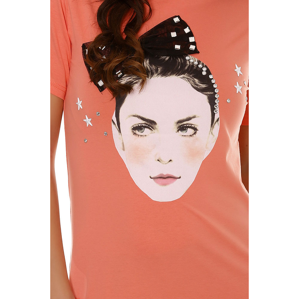 Tshirt corail bimatière avec dentelle sur le bas et un visage sur le devant